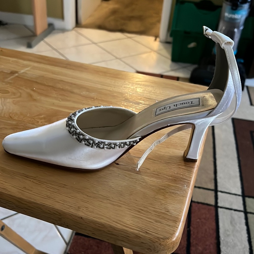 Touch ups shoes size 9.5W color white. Cleaning out my closet and wore one time.